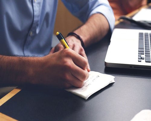Man stretching near his office desk